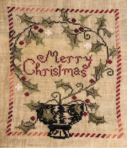 Merry Christmas stitched by Bonnie Rogers.