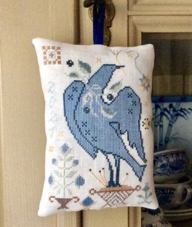 Sewing Bird stitched in blue by Ton Wolswijk.