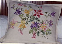 Eva Rosenstand counted cross stitch pillow.